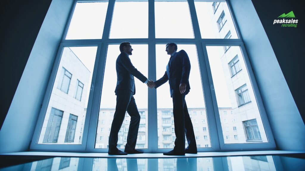 Business professionals shaking hands.