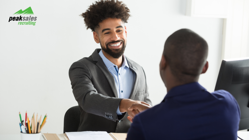 Two businessmen shaking hands in an office