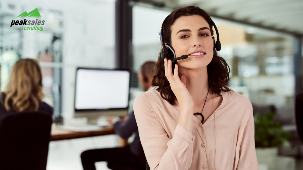 A customer service representative with a headset in an office.